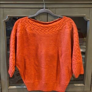 Crew neck sweater. Burnt orange color.